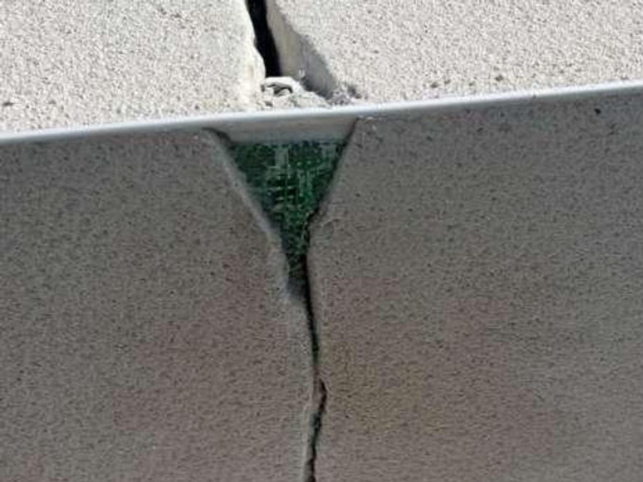 Cracked render repaired, before